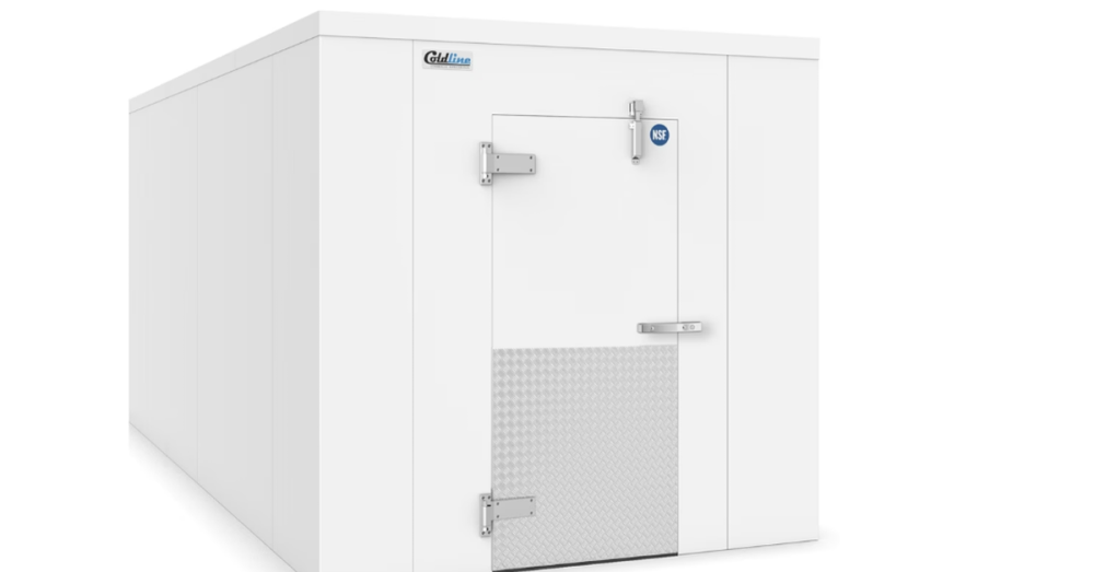 A wide square-shaped metal walk-in cooler for a commercial property. The front door of the cooler is closed.