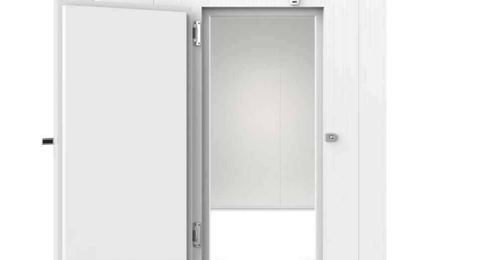 A tall, clean metal walk-in cooler for a commercial business. The walk-in cooler's large door is open.