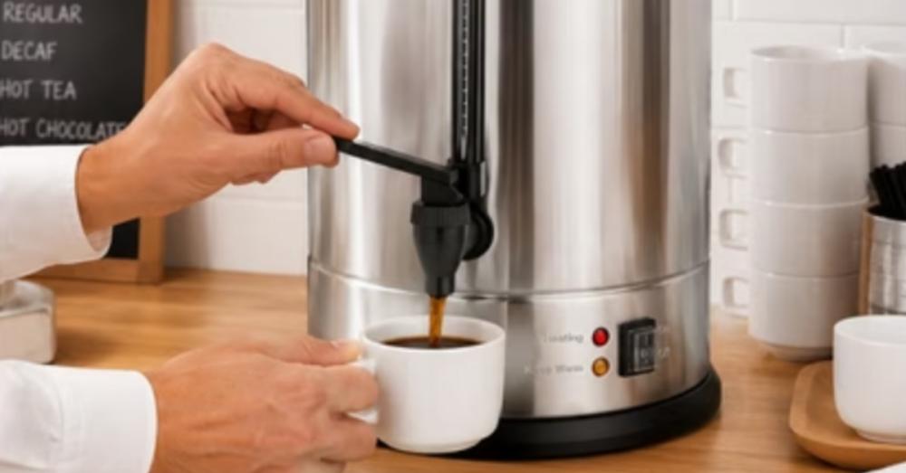 A person holding a tab on a coffee pot in a bright room to release coffee into their small white mug.