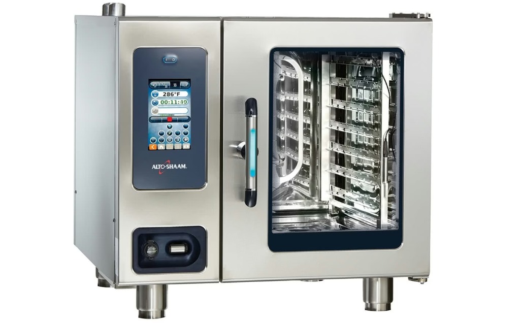 A silver, compact commercial combi oven with a bright blue handle. A label on the oven says "Alto-Shaam".